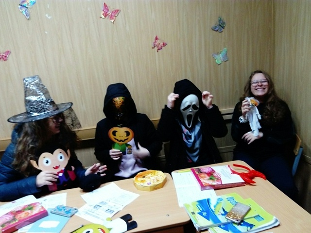Girl Students Wearing Halloween Masks At School