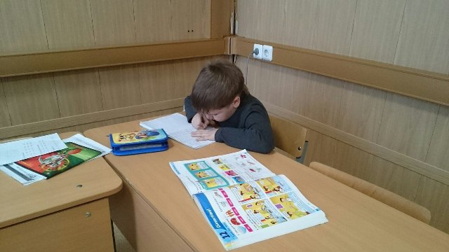 Little Pupil Doing English Exercices In School