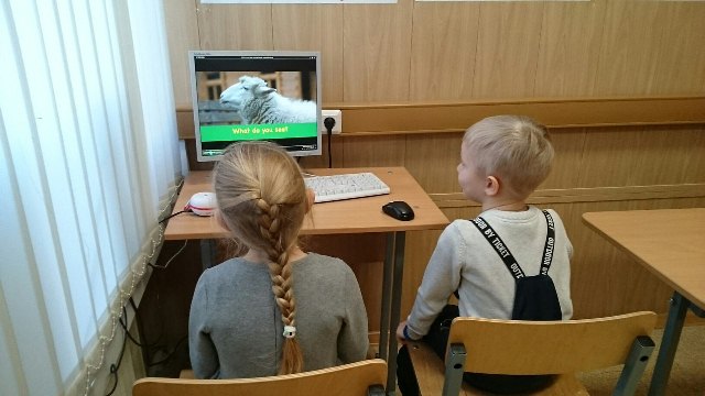 Two Pupils Looking At A Goat On The Computer Screen At School