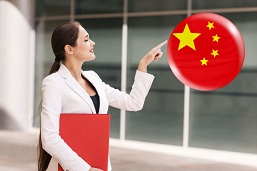 Girl Touching A Globe With The Chinese Flag In The Air
